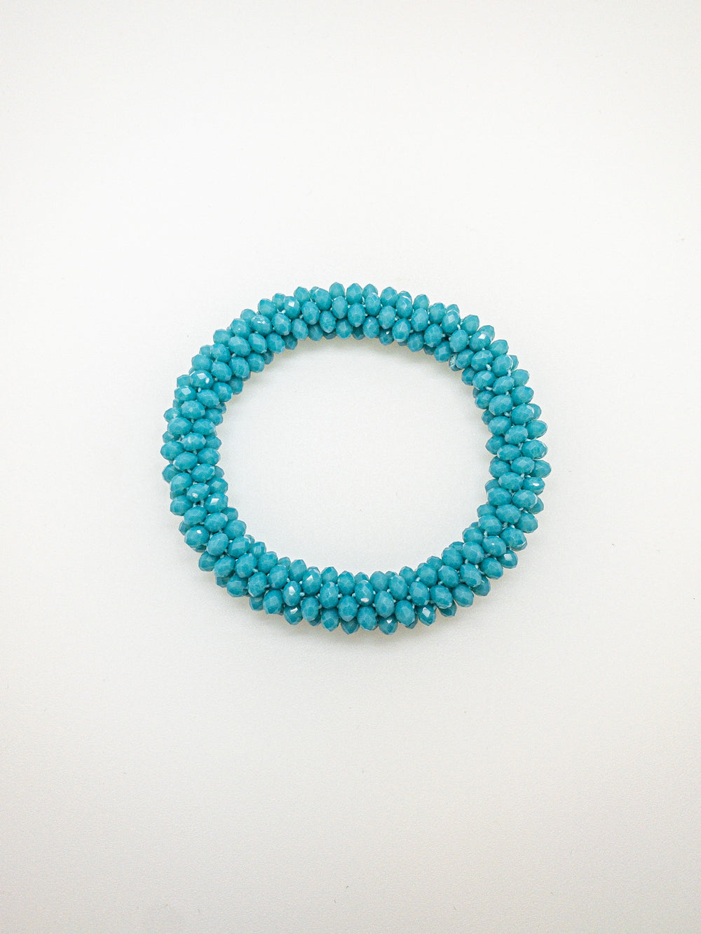Luna bracelet in blue on flat lay