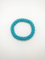 Luna bracelet in blue on flat lay