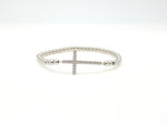 Silver beaded cross bracelet.