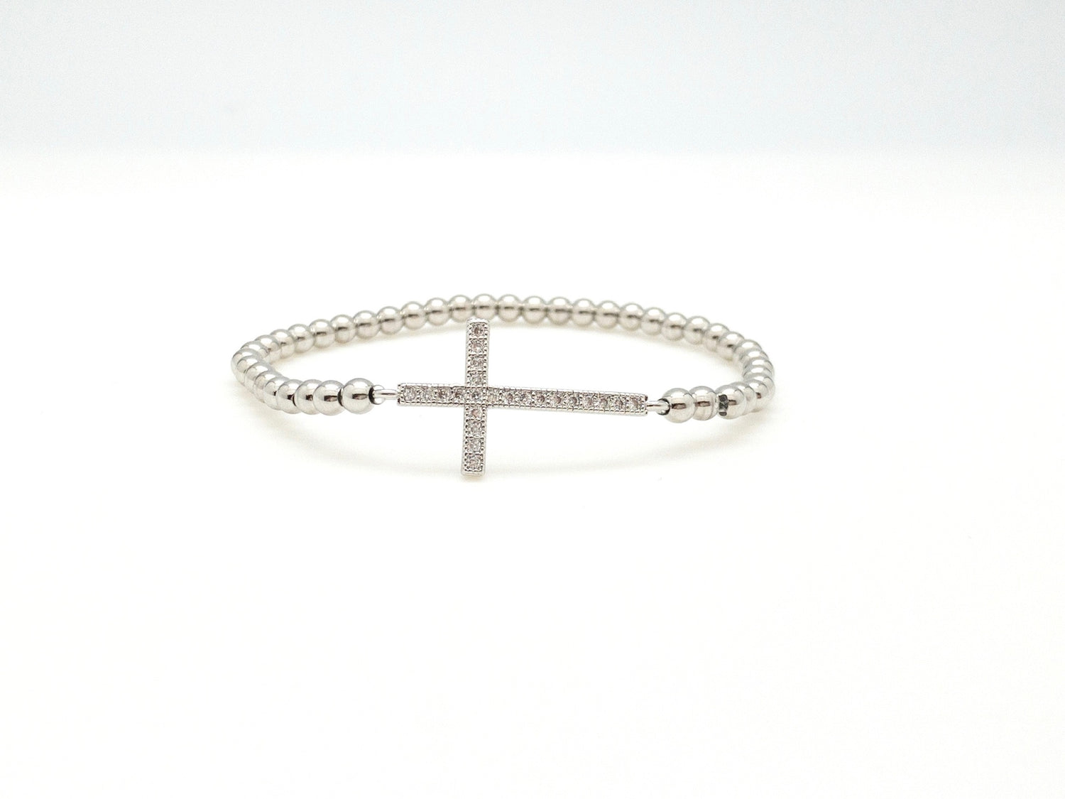 Silver beaded cross bracelet.