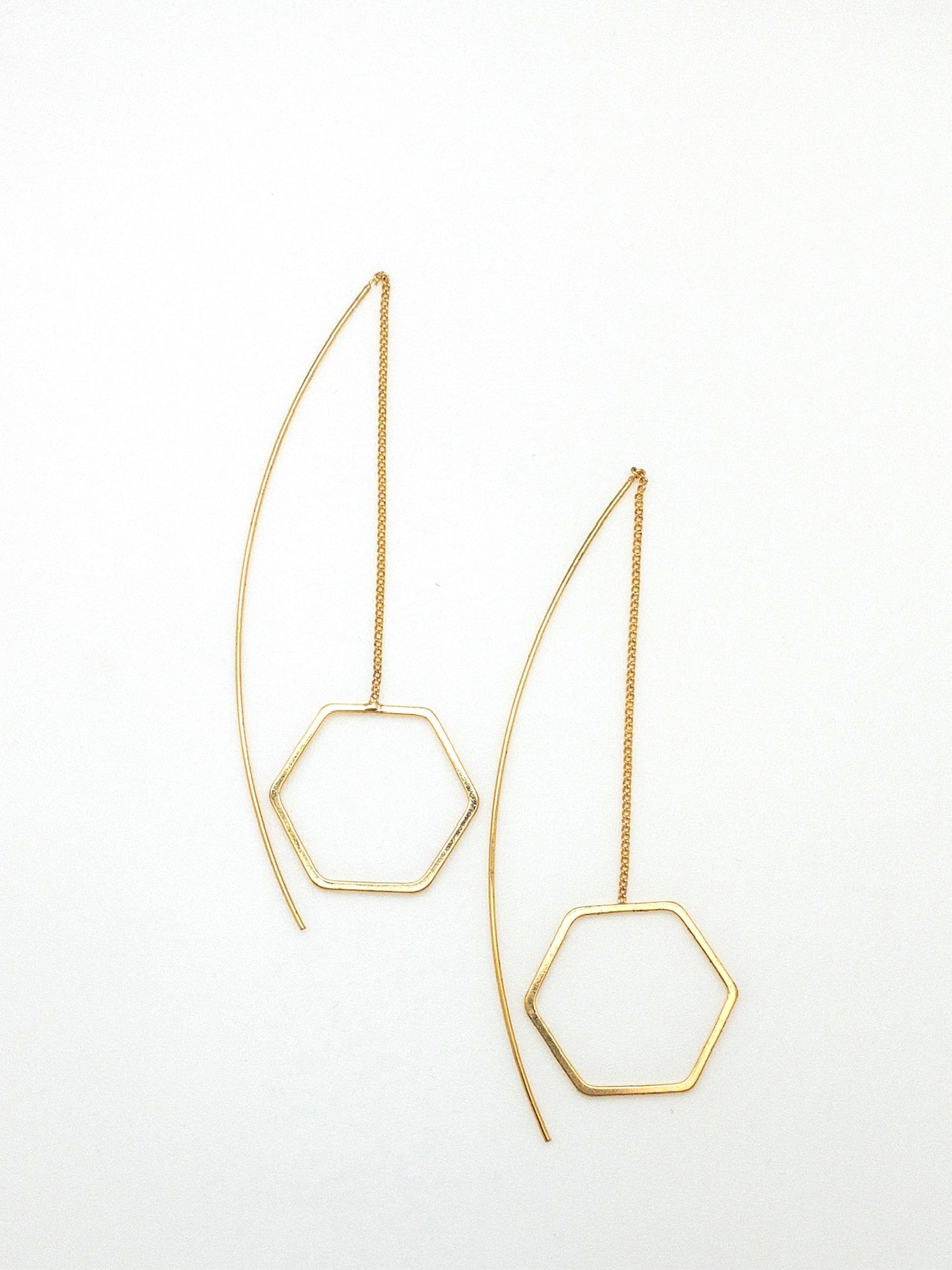 Gold Octavia earrings with dangling hexagon shaped accent 