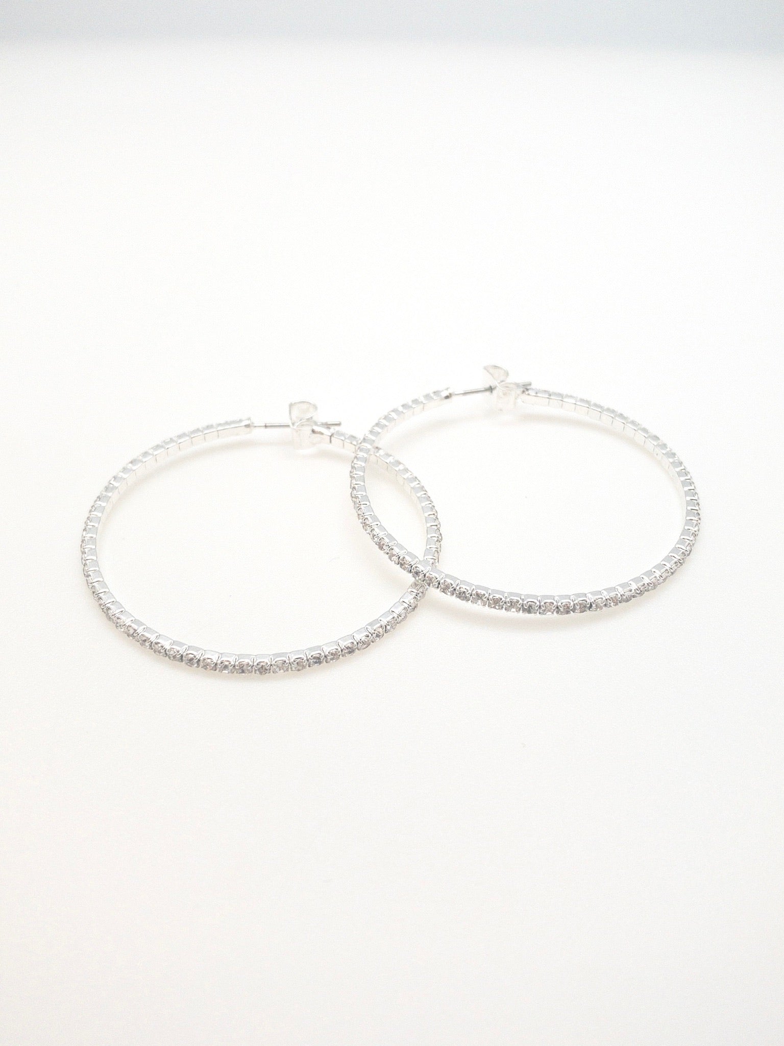 Blaise medium sized sparkly hoops. silver