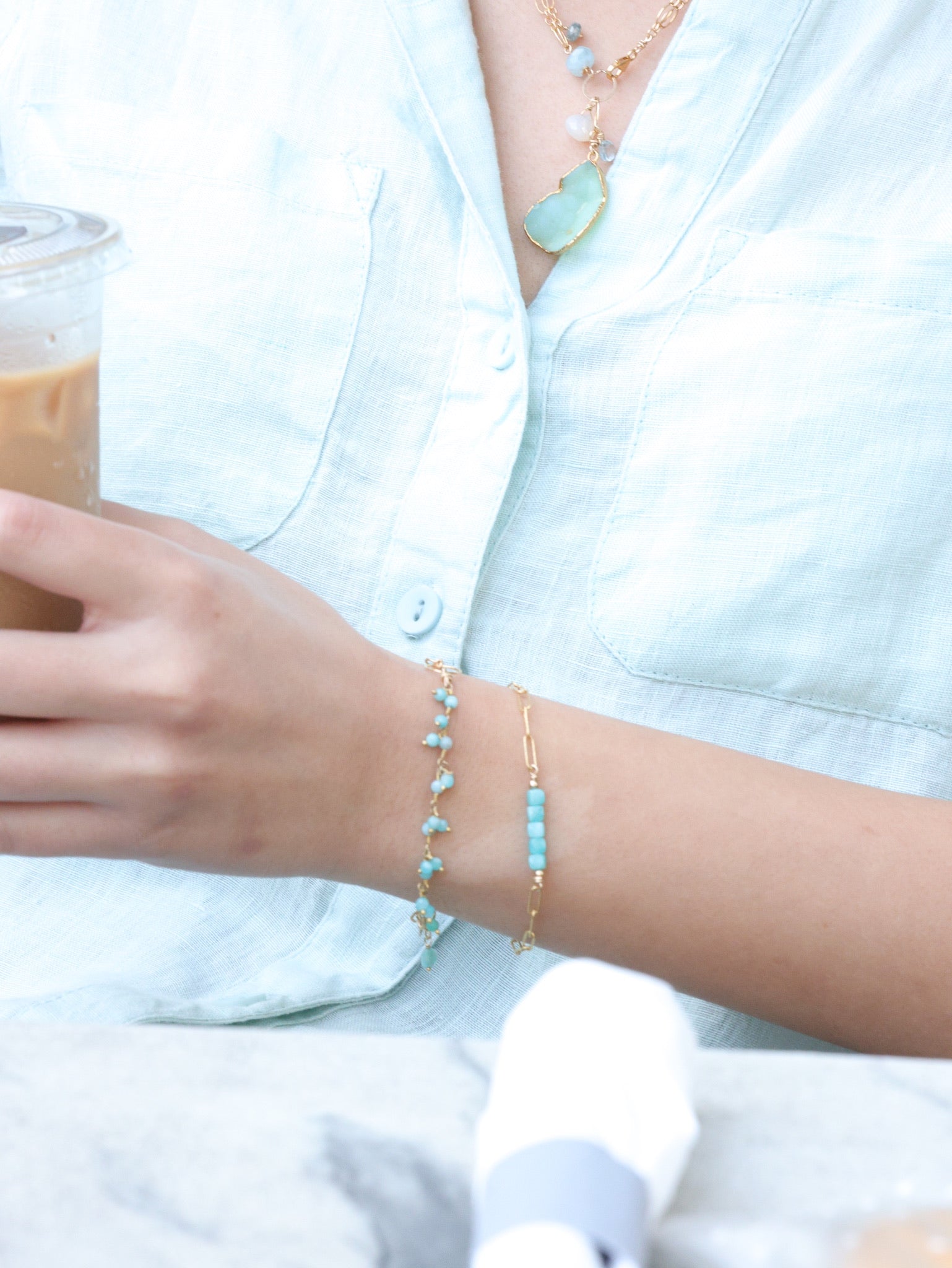 amazonite cube bracelet shown layered on model 