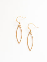 sady earrings in matte gold on flat lay 