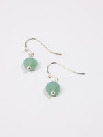 Cara earrings- Aqua Silver on flat lay 