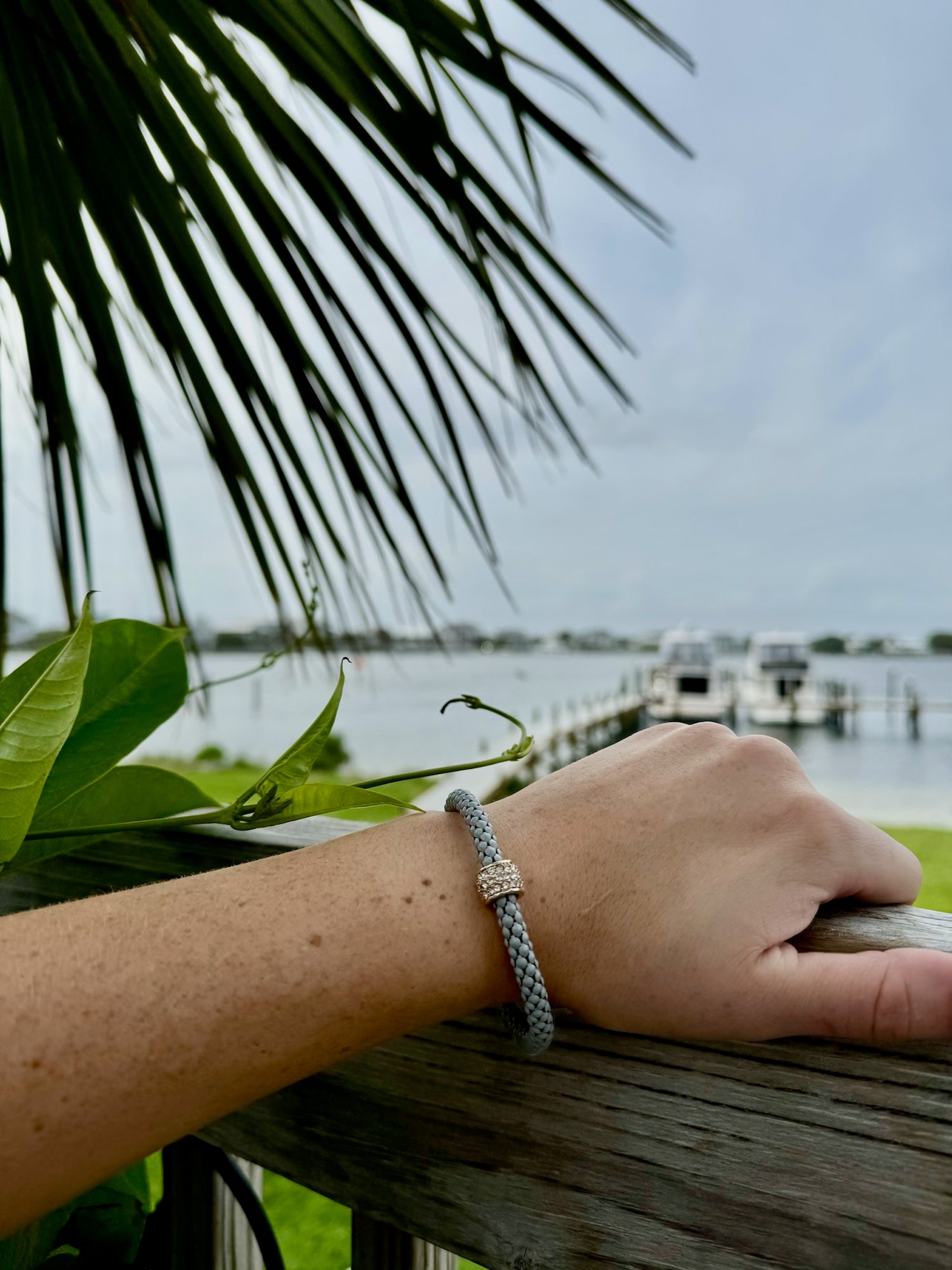 Model wearing Scarlett bracelet in grey