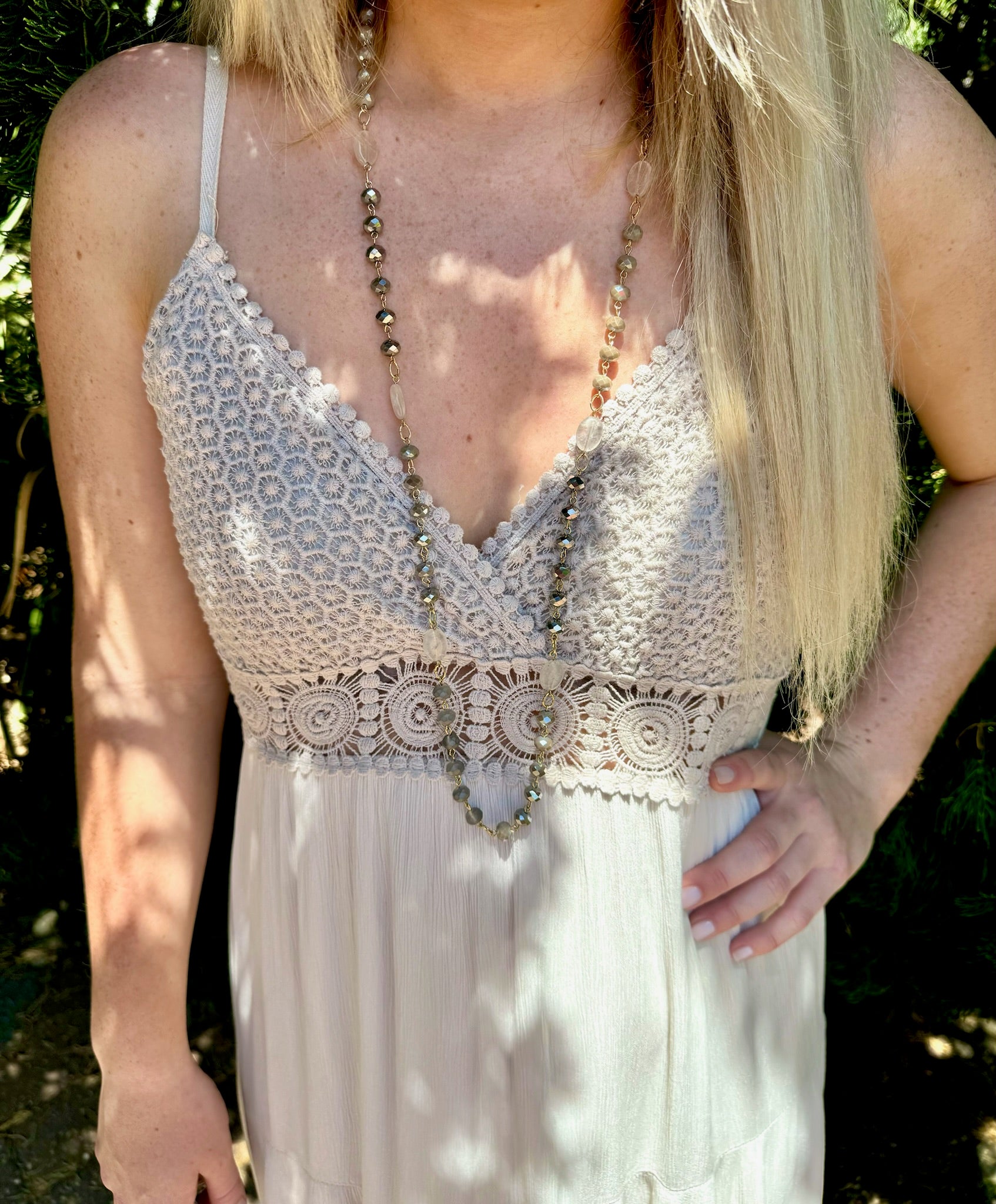 Close up photo of Mia Dress in beige detailing on the top of dress on model