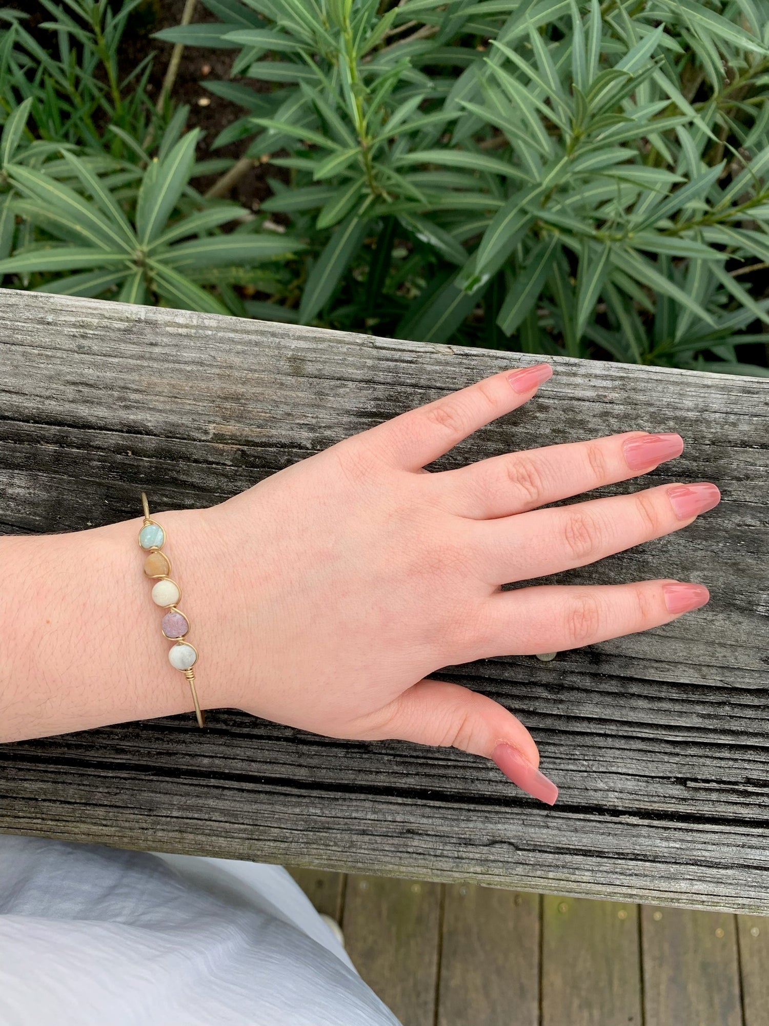 Tracy Bracelet. Gold wire wrapped beads on model.