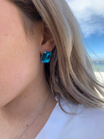 Jilliana large rectangular turquoise studs on model 