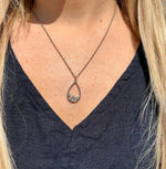 Rowan drop necklace silver on model. 