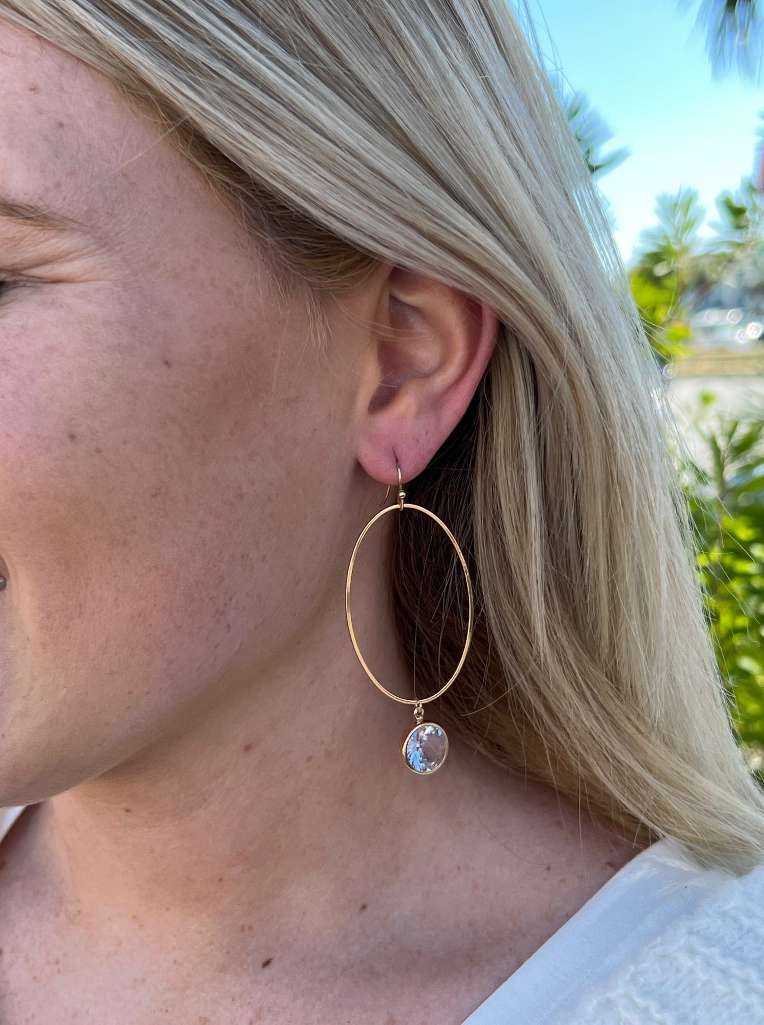 Gold plated Dangly hoop earrings Sparkly crystal accent Length : 2 1/2"