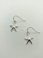 Small Dangly Starfish earrings in silver. Layne.