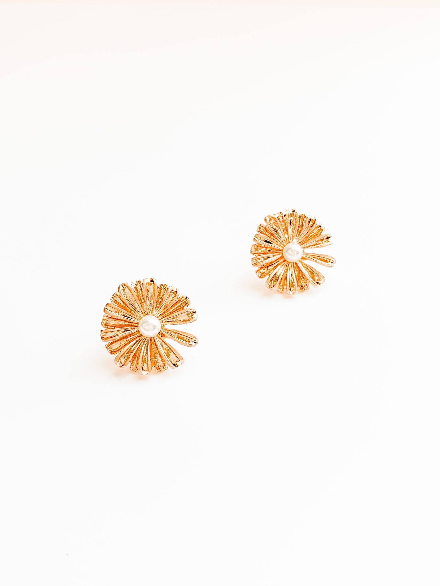 Catie earrings. Sunflowers with a pearl in the center 